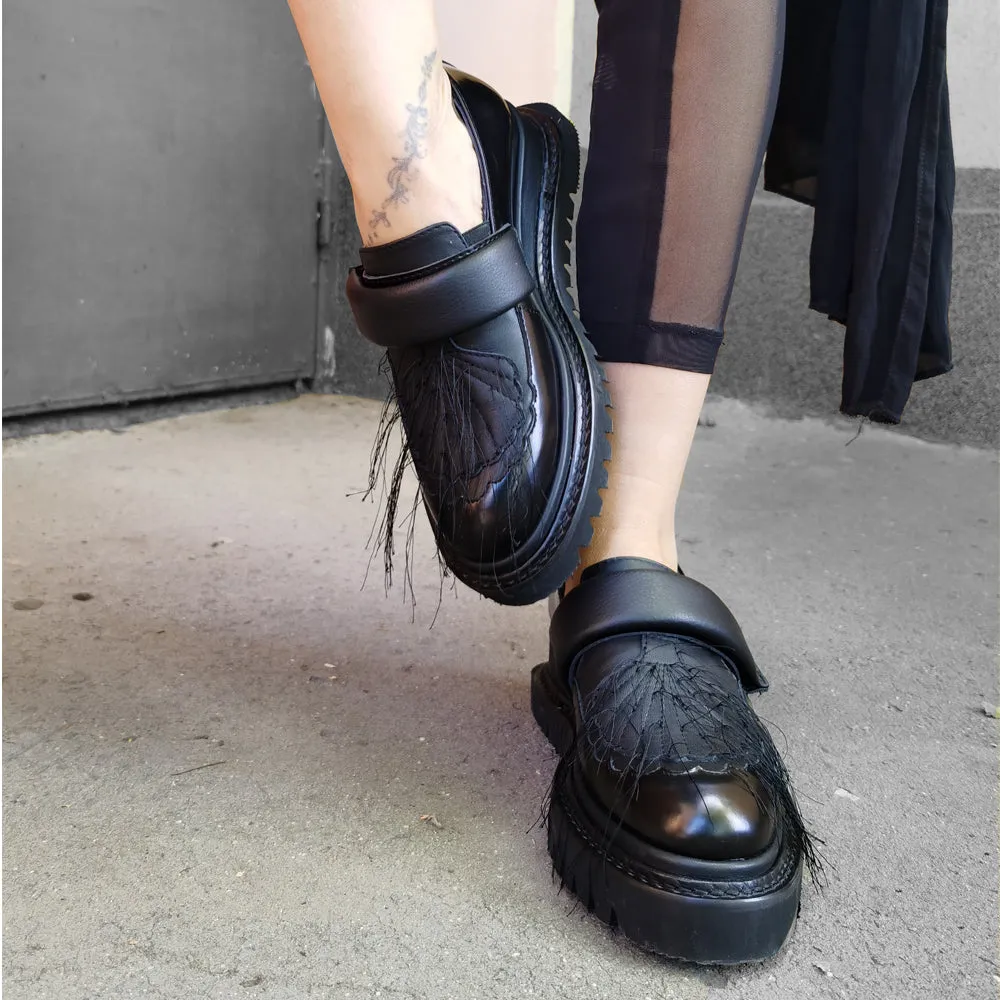 In the Spotlight black leather shoes