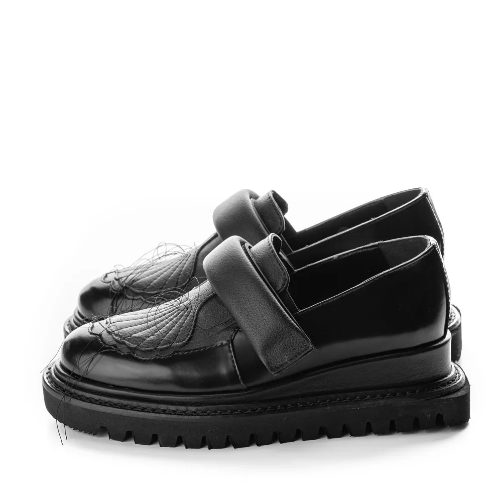 In the Spotlight black leather shoes